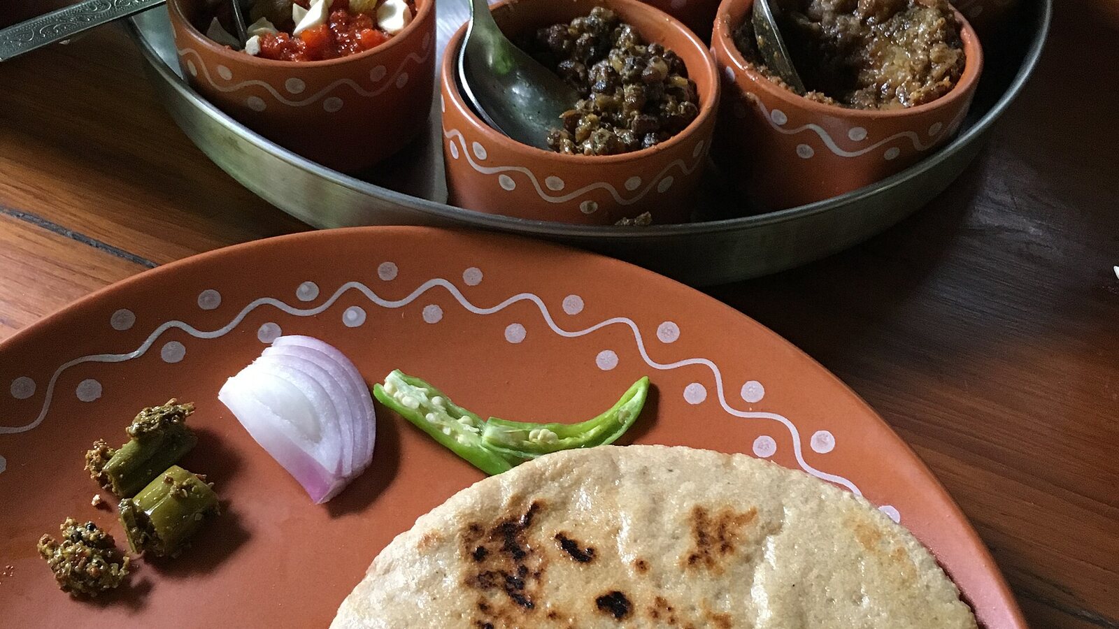 Traditional Himachali Dham dishes arranged for serving.