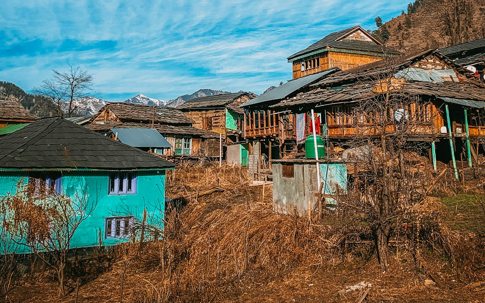 Houses under a blue sky at Garahan, Himachal Pradesh.