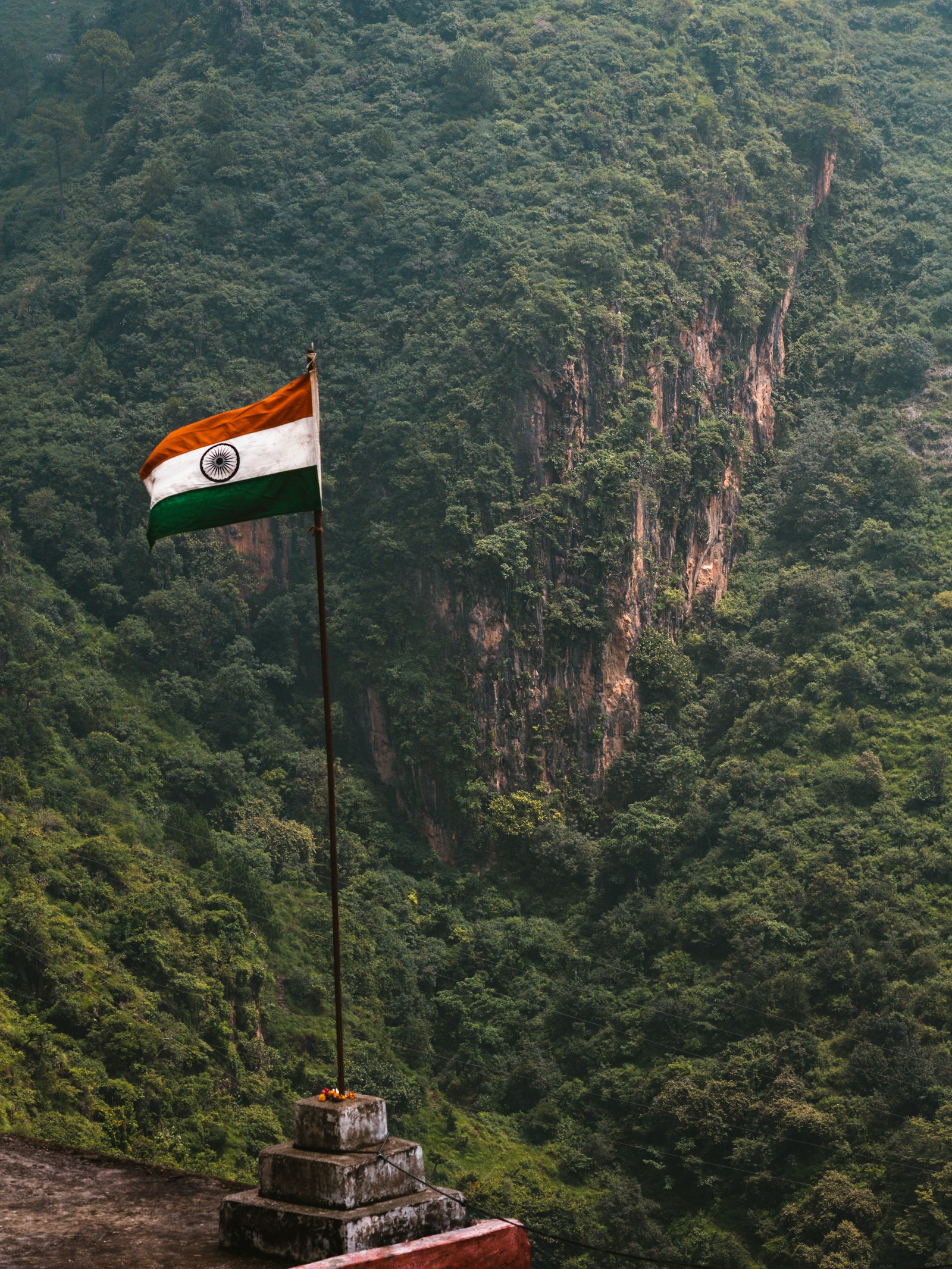 A flag above a mountain valley in Sirmaur district.